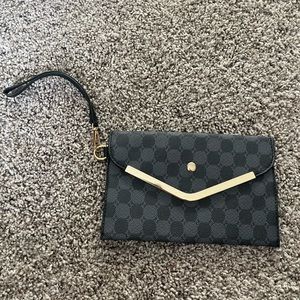 Black checkered wristlet